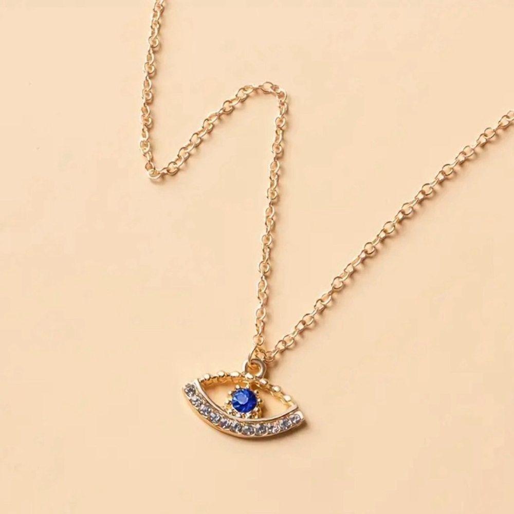 Gold Eye Pendant Necklace with Blue Gem